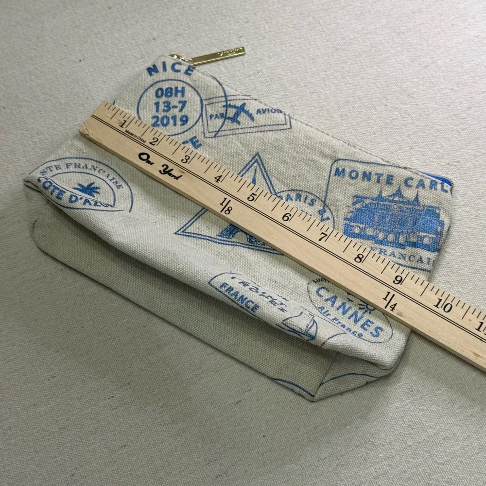 Lancôme Paris canvas cosmetic bag - blue passport stamp design